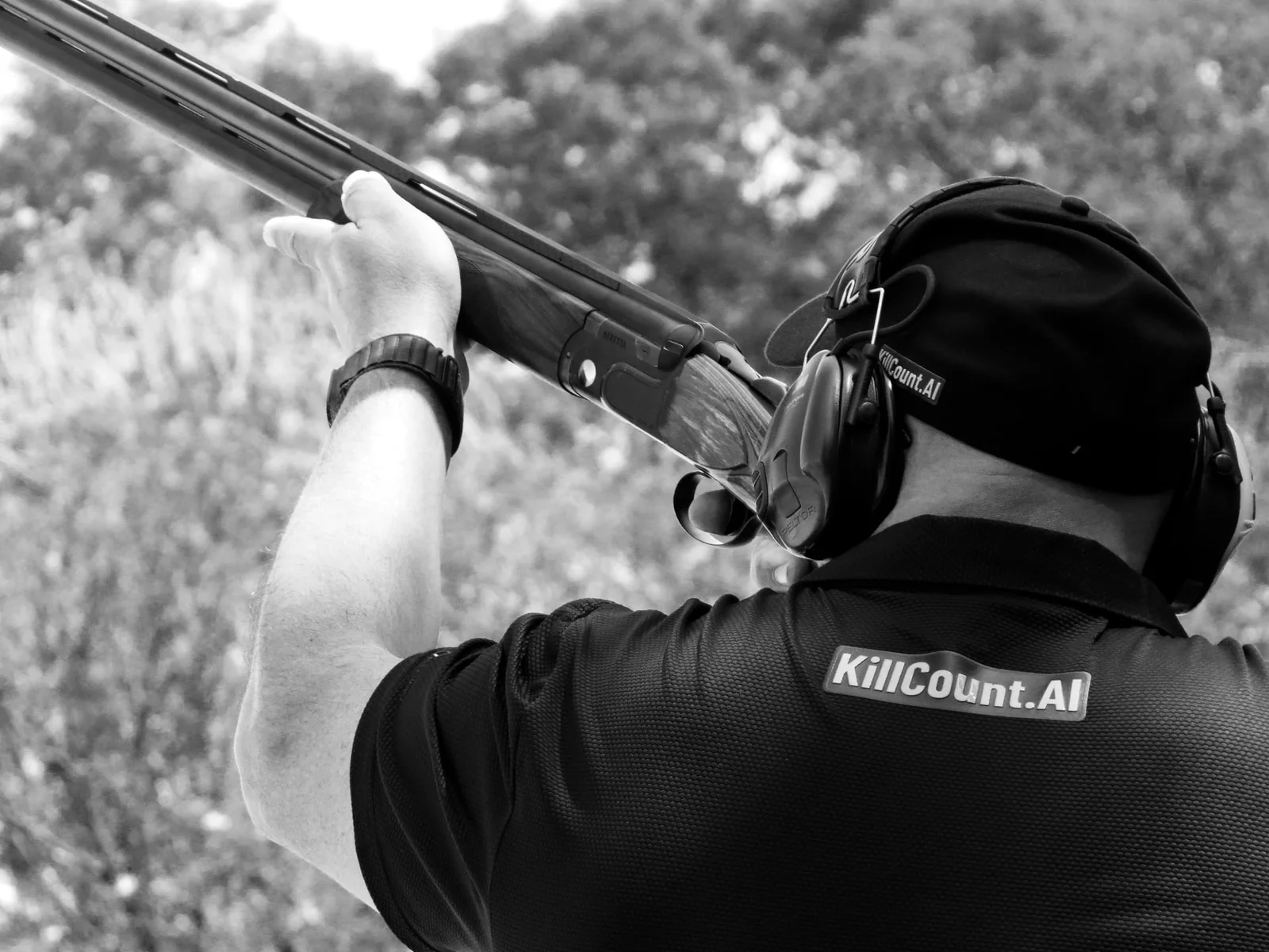 Hardus van Pletsen shooting a clay target at the range in KillCountAI apparel